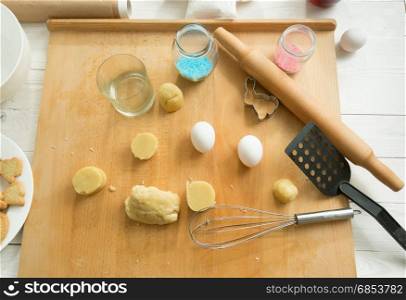View from above on kitchen utensils and dough