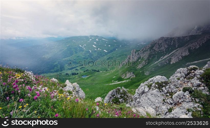View from above on mountain valley covered with gloomy clouds. Lagonaki, Caucasus, Russia