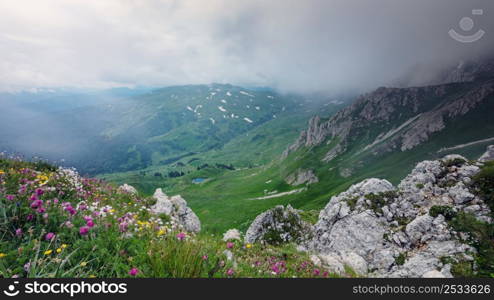 View from above on mountain valley covered with gloomy clouds. Lagonaki, Caucasus, Russia