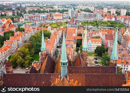 View from above on the Old town of Gdansk (Danzig) in Poland, on the first plan Church of the Blessed Virgin Mary (Polish: Bazylika Mariacka) rooftop and spires