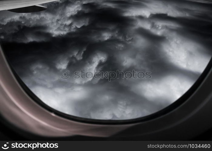 View from airplane window with a thunderstorm