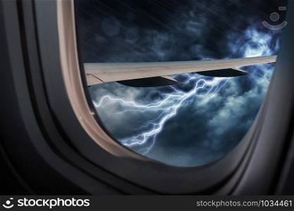 View from airplane window with a thunderstorm