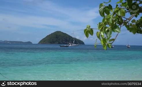 View from beach on beautiful tropical island and sea with boats landscape, Thailand