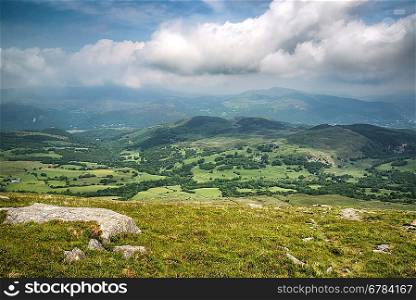 View from Cadair Idris looking North towards Dolgellau over fields and countryside landscape