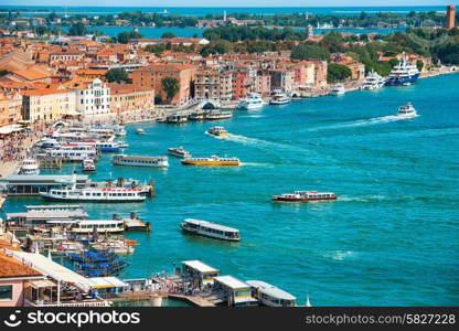 View from Campanile bell tower on boats and ships in Grand Canal. Sunny day in Venice, Italy.