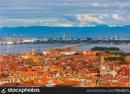 View from Campanile di San Marco to bridge between the island and the mainland of Venice Mestre, the seaport and the mountains at summer morning in Venice, Italy
