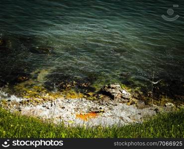 View from cliff on water of Black Sea. Beautiful transparent water of Black Sea, exploration and nature concept, Romania, Dobrogea region.. View from cliff on water of Black Sea.