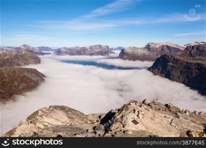 View from Dalsnibba mountain to clouds over Geiranger in Norway