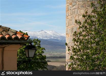 View from fortress in Avila on mountains covered with snow,