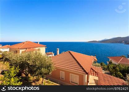 View from high angle on houses roofs in seaside greece town. Greek, Mediterranean architecture.. Houses roof on greek seaside