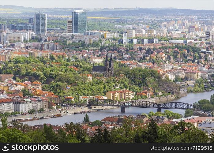 View from Petrin hill to Vyshehrad and remote modern districts of the city. Prague. Czech Republic