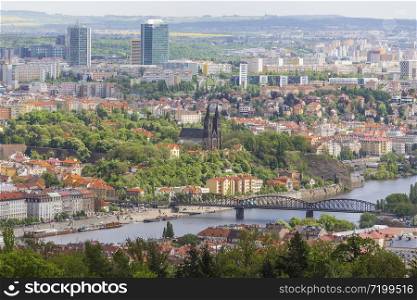 View from Petrin hill to Vyshehrad and remote modern districts of the city. Prague. Czech Republic