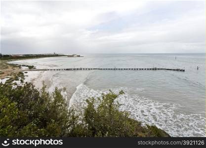 View from Shortland Bluff in Queenscliff towards the old pilot pier and the western side of the entrance to Port Phillip Bay in Melbourne, Australia