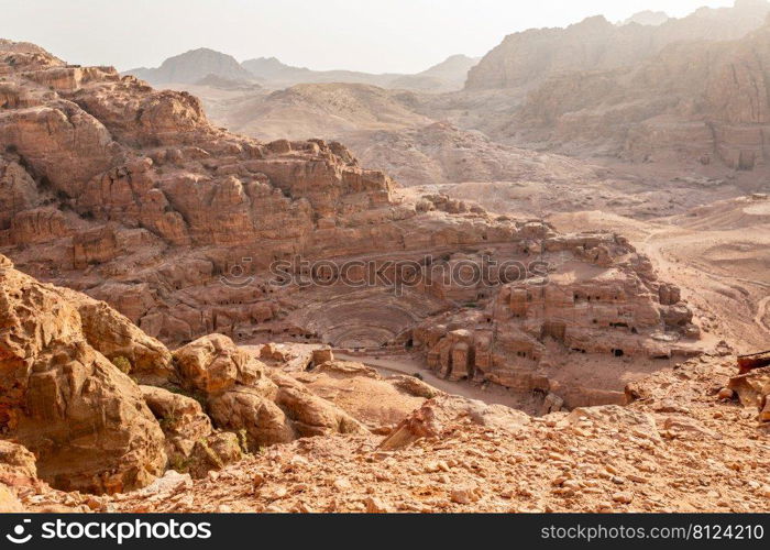 View from the above to the Nabataean theatre carved in stone and surrounding tombs, Petra, Jordan