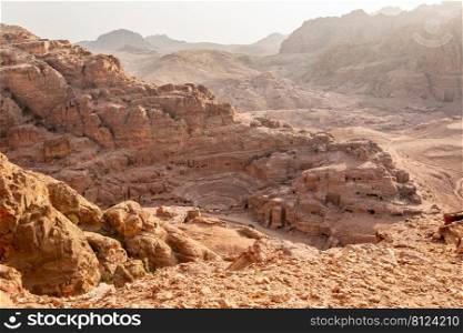 View from the above to the Nabataean theatre carved in stone and surrounding tombs, Petra, Jordan