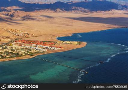View from the airplane window of the mountains and sea resort of Egypt, Sharm El Sheikh