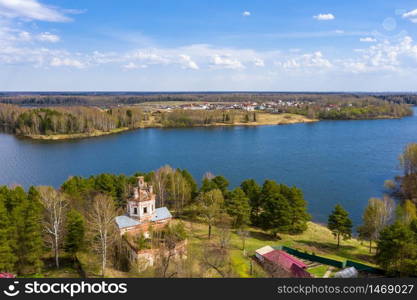 View from the drone of a dilapidated church on the banks of the Uvodsky reservoir on a spring day, the village of Yegoriy, Ivanovo Region, Russia.