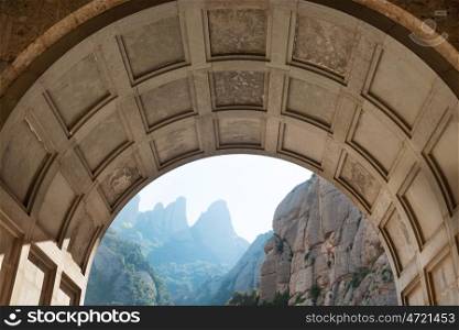 View from the entrance of famous Montserrat monastery to buildings and mountain