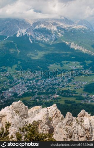 view from the Mountain of Typical Village in Italian Dolomites Alps: Houses and Green Meadows