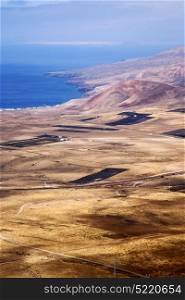 view from the top in lanzarote spain africa and house field coastline