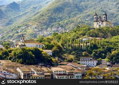 View from the top of the historic center of Ouro Preto with its houses, church, monuments and mountains. View from the top of the historic center of Ouro Preto