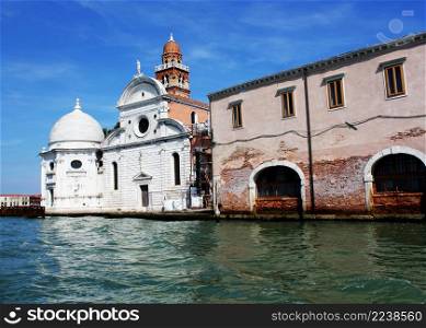 View from the Venice lagoon of the church of San Michele in Isola on the cemetery island of San Michele at sunset, Venice, Italy. View from the Venice lagoon of the church of San Michele in Isola on the cemetery island of San Michele , Venice, Italy