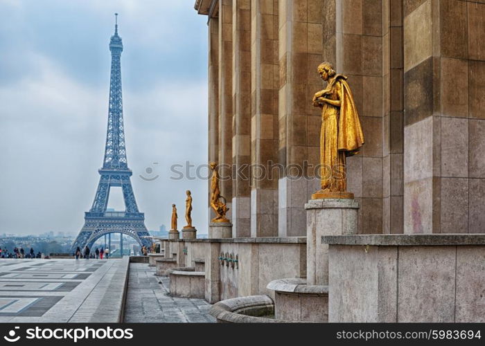 view from Trocadero with golden statues on Eiffel tower, Paris