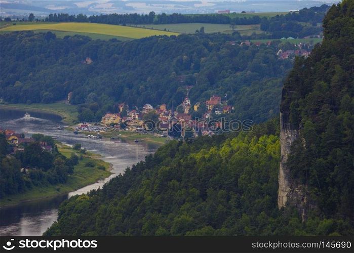 View from viewpoint of Bastei in Saxon Switzerland, Germany to the mountains at sunrise in the morning fog, National park Saxon Switzerland