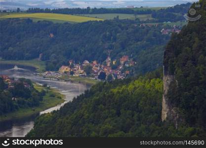 View from viewpoint of Bastei in Saxon Switzerland, Germany to the mountains at sunrise in the morning fog, National park Saxon Switzerland