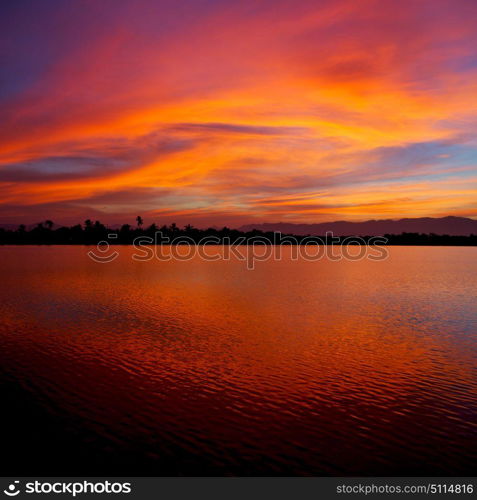 view from water of the sunrise full of colors and rain concept of relax