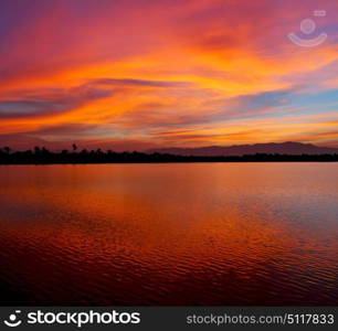 view from water of the sunrise full of colors and rain concept of relax