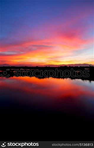 view from water of the sunrise full of colors and rain concept of relax
