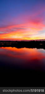 view from water of the sunrise full of colors and rain concept of relax