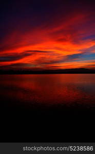 view from water of the sunrise full of colors and rain concept of relax