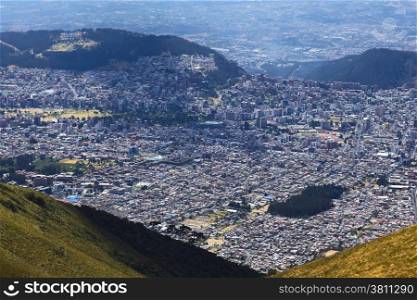 View from West to East over Quito, Ecuador from the Cruz Loma lookout close to the TeleferiQo cablecar station on the Pichincha mountain