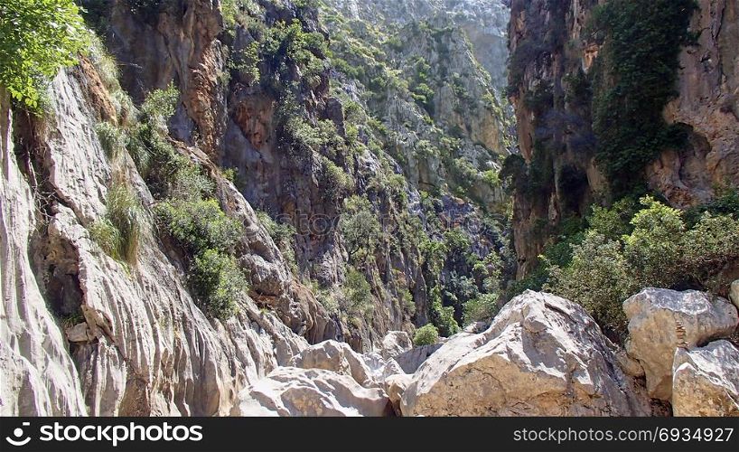 View in a canyon on the Spanish island in the Mediterranean island of Mallorca with large boulders