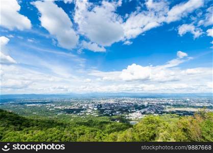 view in the mountains with cityscape over the city airatmosphere bright blue sky background abstract clear texture with white clouds. of Chiang Mai,Thailand