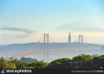 View of 25 April bridge and Christ the Kingmonument. Lisbon, Portugal
