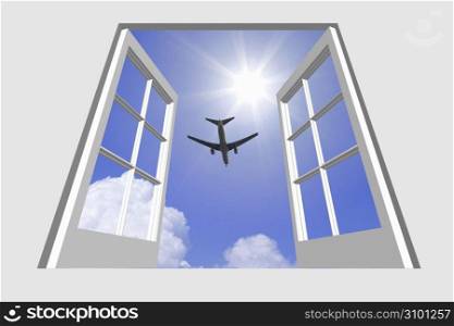 View of a aeroplane gliding through a blue sky through a window frame