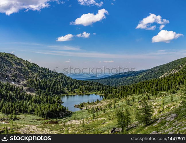 View of a beautiful green valley with one of Karakolskie lakes in Altai Republic, Siberia, Russia