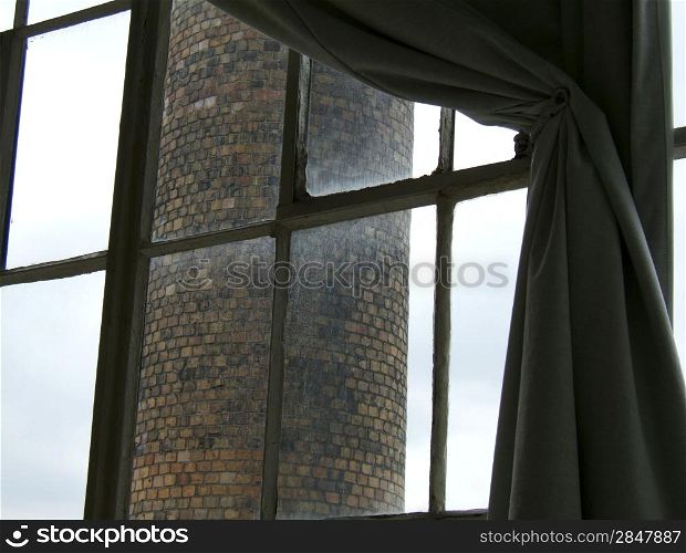 View of a brick chimney through a window