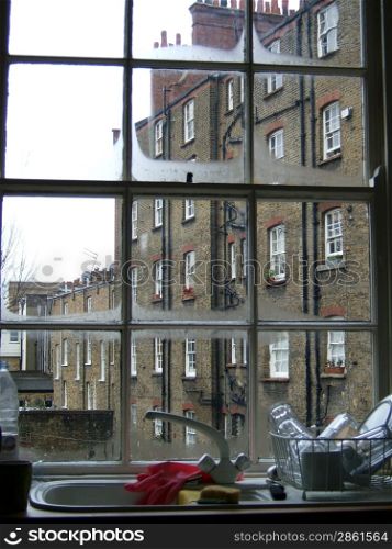 View of a building through a kitchen window