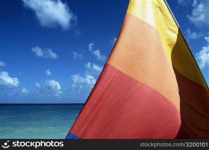 View of a colorful sail with sea in the background, Jamaica