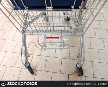 view of a empty shopping cart in supermarket