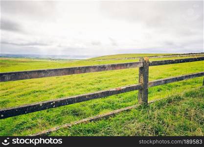View of a fence on the Cliffs of Moher, Ireland