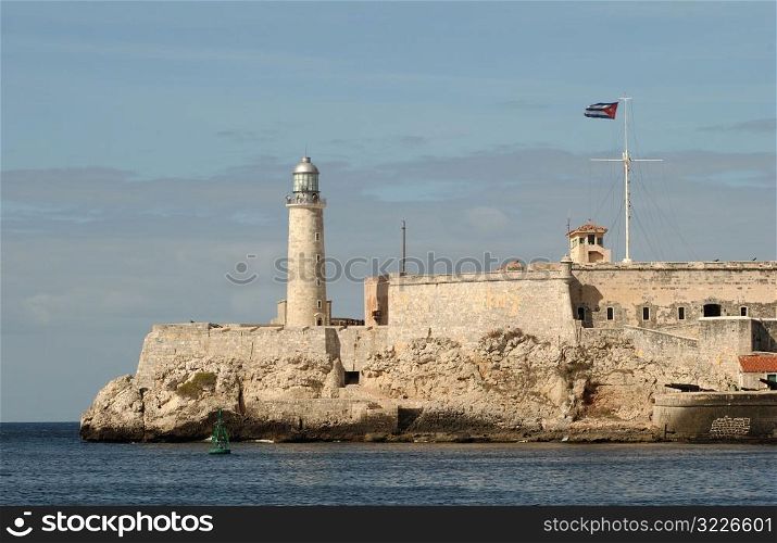 View of a fort and lighthouse on the seafront, Havana, Cuba