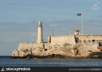 View of a fort and lighthouse on the seafront, Havana, Cuba