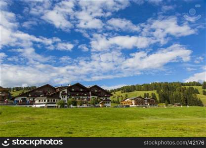View of a group of houses in the village of Saltria in Seiser Alm
