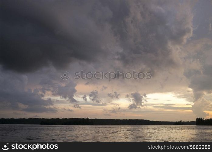 View of a lake at sunset, Lake Of The Woods, Ontario, Canada