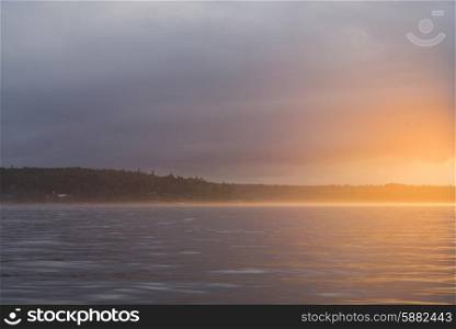 View of a lake at sunset, Lake Of The Woods, Ontario, Canada